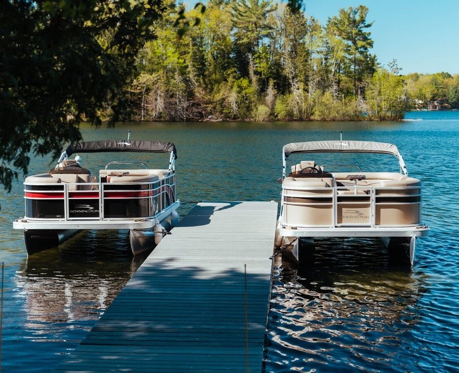 pleasure watercraft aluminum pontoon boats at a dock