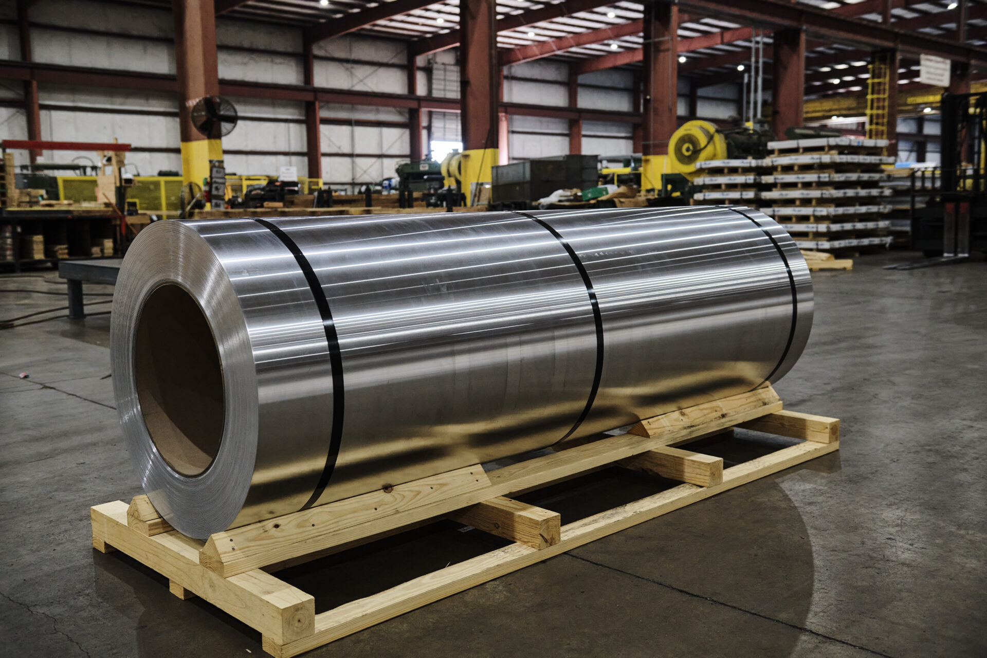 aluminum coil sitting on a pallet in a warehouse