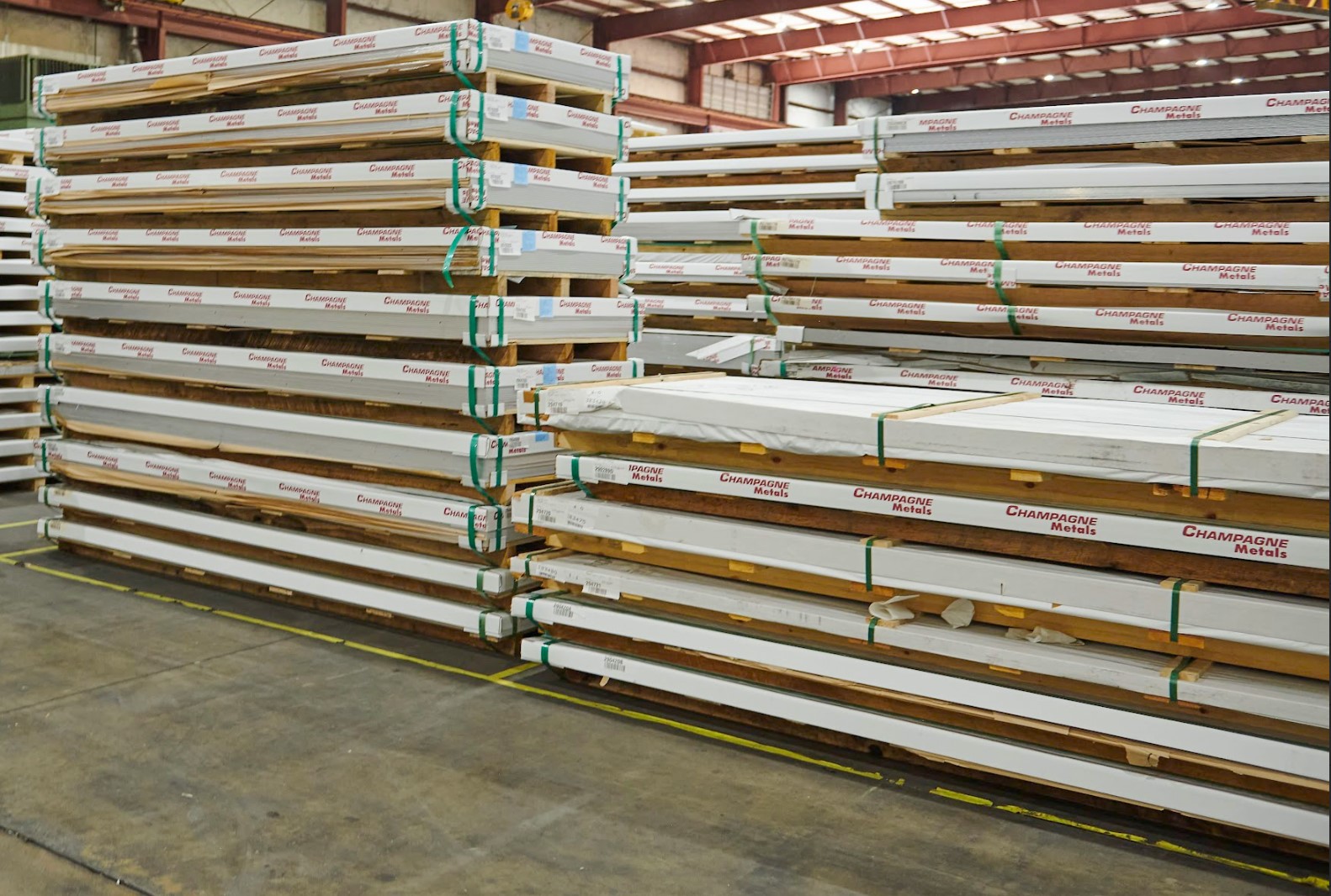 stacks of aluminum sheet stock in a warehouse